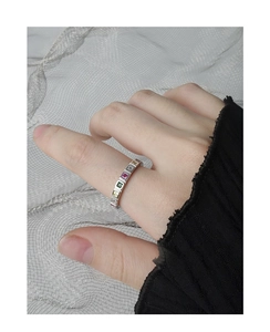 Close-up of S925 silver ring featuring vibrant square-cut rainbow cubic zirconia stones