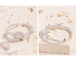 Macro detail of S925 sterling silver opal ring with lava texture and hallmark