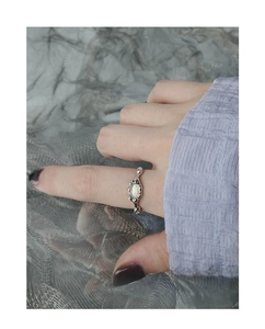 Close-up of S925 sterling silver opal ring featuring irregular lava texture and iridescent stone