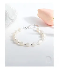 Detailed close-up of Baroque pearl bracelet with silver beads and adjustable extension chain