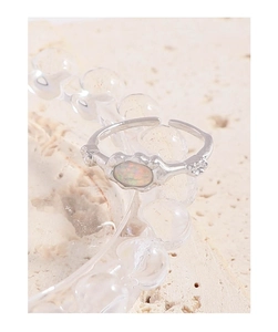 Macro shot of oval opal stone set in an adjustable 925 sterling silver ring band