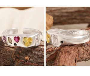 Detailed macro view showing S925 silver hallmark and colorful zircon stones on ring