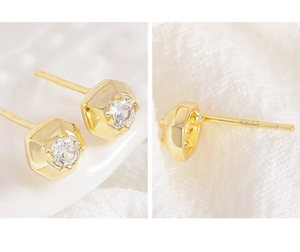 Detailed close-up of gold geometric S925 sterling silver stud earrings with round zircon