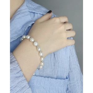 Elegant S925 sterling silver bracelet with baroque pearls and small silver beads on wrist