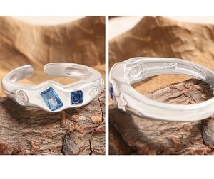 Macro detail of S925 sterling silver stamp and micro-inlaid zircon gemstones on the ring