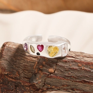 S925 sterling silver open ring with colorful zircon stones on rustic wood base