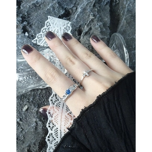 S925 silver ring set featuring blue zircon and irregular lava texture on fingers