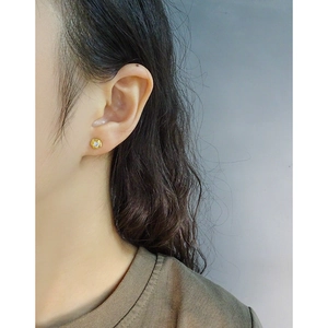 Minimalist S925 silver hexagonal gold stud earring with round zircon on female model