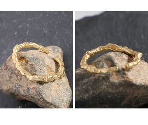 Detail view of gold S925 sterling silver ring with irregular branch vine texture