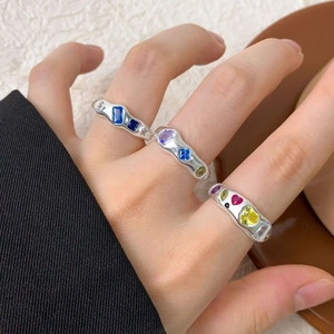 S925 sterling silver wavy rings with colorful zircon inlays shown on a hand