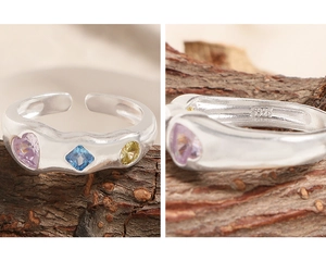 Macro detail of S925 sterling silver ring showing hallmark and colorful zircon stones