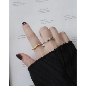 Minimalist S925 sterling silver lava rings in gold and silver finish set on a hand