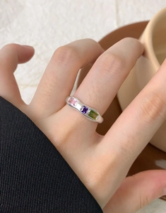 Detail of S925 silver ring featuring three rectangular micro-set colored zircon stones