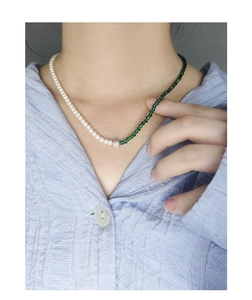 Detail view of asymmetric S925 silver necklace with green sandstone and white pearls