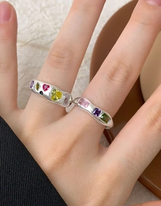 Detailed close-up of S925 silver rings with colorful micro-inlaid zircon gemstones