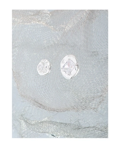 Detailed macro view of S925 silver earrings with zircon in asymmetric pleated texture