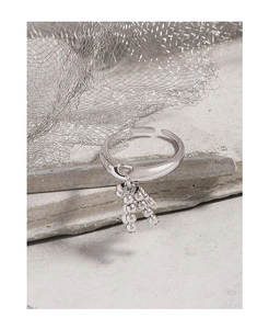 Macro shot of S925 sterling silver open ring with dangling bead cluster on stone