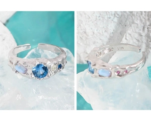 Close-up of S925 silver ring with wrinkled texture, blue zircon and opal stones