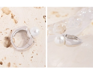 Detailed close-up showing the S925 silver hallmark and lustrous pearl on the earring