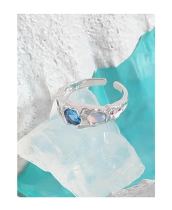 Detailed macro view of S925 sterling silver ring with blue zircon and textured finish