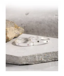 Close-up of S925 sterling silver rings with brushed finish and zircon inlays on stone