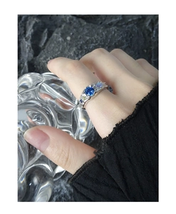 Close-up of S925 silver ring with wrinkled texture and blue zircon center stone