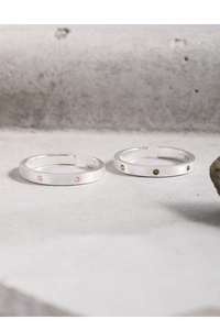 Detail of S925 sterling silver matte rings with pink and green zircon stones
