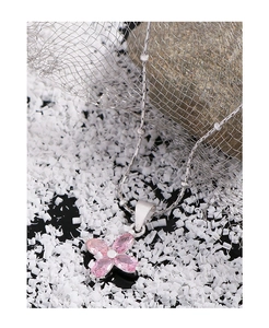 Macro view of S925 sterling silver necklace with pink cherry blossom zircon pendant