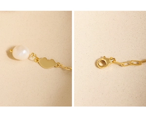 Detail of S925 sterling silver lobster clasp and baroque pearl with lip pendant