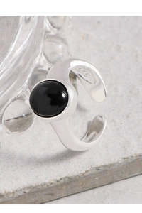 Macro shot of S925 sterling silver ring with oval black onyx gemstone and S925 hallmark