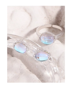 Macro shot of S925 silver earring and ring set with translucent blue moonstone gems