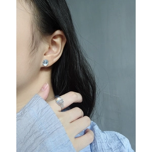 Minimalist S925 silver moonstone stud earrings and ring set worn by a model