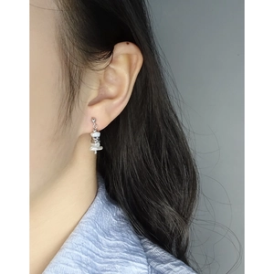 Minimalist S925 sterling silver drop earrings with irregular pearls on a female model