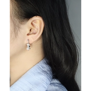 Minimalist S925 sterling silver drop earrings with irregular pearls on female model
