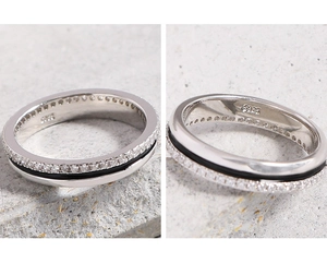 Detail of S925 sterling silver ring with black enamel inlay and sparkling zircon stones
