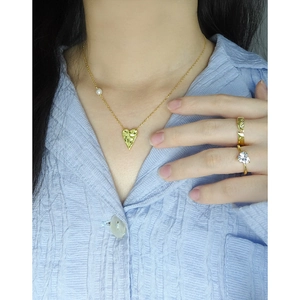 S925 silver necklace with textured heart pendant and pearl paired with gold rings