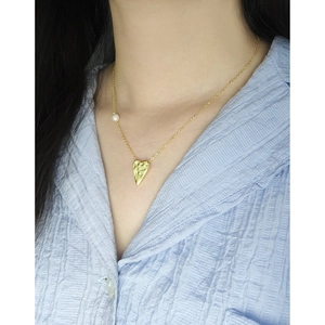 Hammered gold heart necklace with pearl detail on 925 sterling silver chain