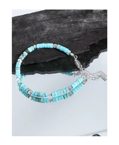 Close-up of S925 sterling silver tag and turquoise beaded bracelet with lobster clasp