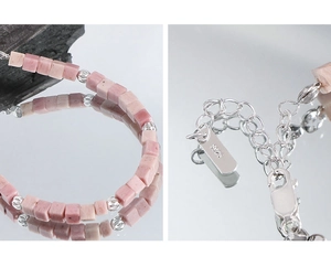 Macro detail of S925 sterling silver lobster clasp and pink rhodochrosite stone beads