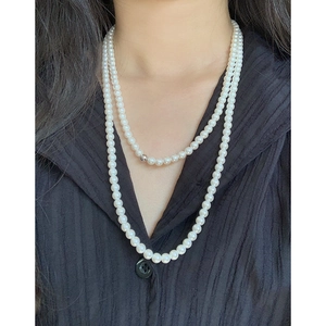 Double-layered S925 silver pearl necklace featuring a short choker and long sweater chain
