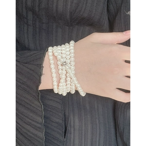 Minimalist S925 sterling silver multi-layer pearl necklace shown on a black background