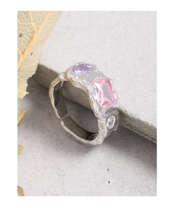 Detail of S925 silver ring with lava texture and colored zircon stones setting