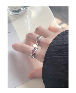 Detailed shot of S925 silver rings with pink and clear rectangular cubic zirconia