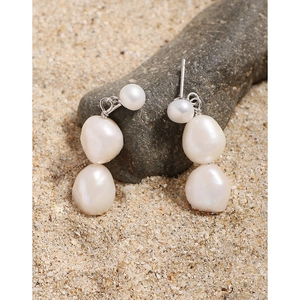Baroque pearl drop earrings in S925 sterling silver on natural beach sand background
