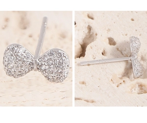 Macro detail of S925 sterling silver stamp on crystal bow knot stud earrings