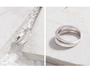 Macro detail of S925 sterling silver stamp on minimalist irregular concave ring band