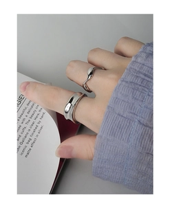 Close-up of S925 sterling silver minimalist wide band and irregular wavy ring set