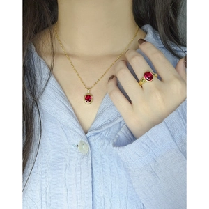 Elegant S925 silver necklace and ring set featuring oval red zircons on model