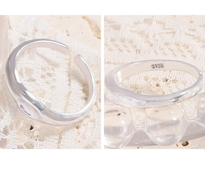 Detail of S925 sterling silver stamp on minimalist wave texture adjustable ring