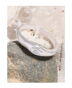 Macro shot of minimalist S925 sterling silver irregular ring with polished fluid design
